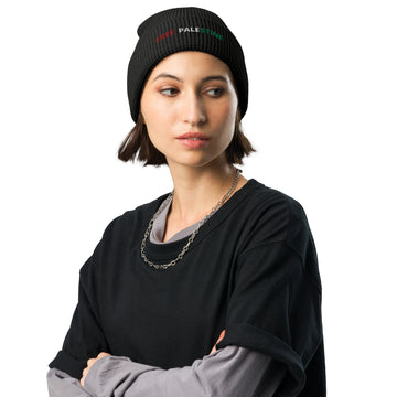 A women wearing Free Palestine black waffle beanie